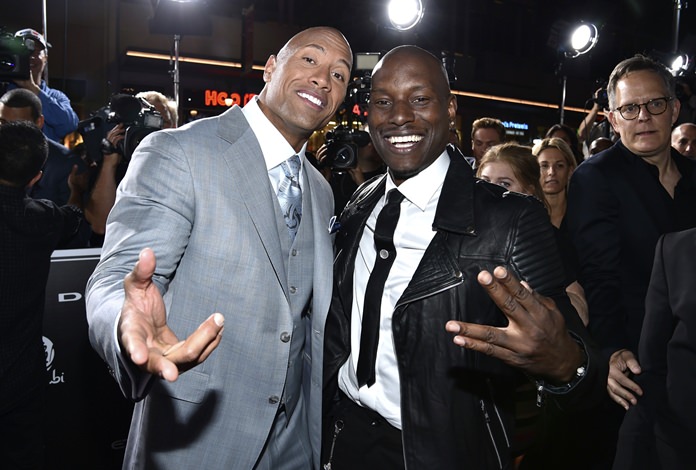 In this April 1, 2015, file photo, Dwayne Johnson (left) and Tyrese Gibson arrive at the premiere of “Furious 7” at the TCL Chinese Theatre in Los Angeles. (Photo by John Shearer/Invision/AP)