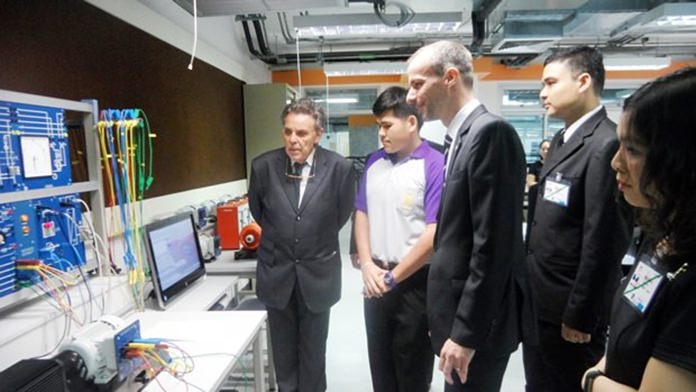 The entourage is given a tour through the Technology College.