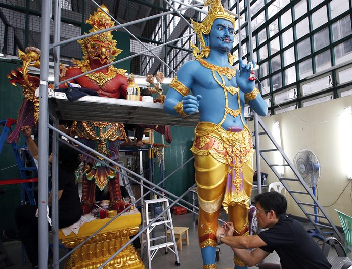 Thai artists and craftsmen are putting the finishing touches on an elaborate crematorium complex ahead of the funeral of King Bhumibol Adulyadej, who reigned for 70 years before his death on Oct. 13, 2016. (AP Photo/Sakchai Lalit)