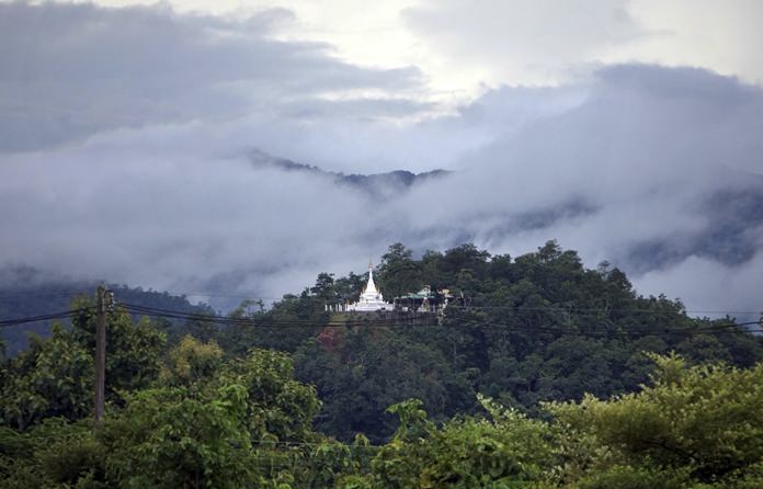 A Buddhist monastery sits atop a hill in Mae Sariang, northern Thailand. The mountains of northern Thailand were seeded by hundreds of projects initiated by the His Majesty late King Bhumibol Adulyadej. (AP Photo/Denis Gray)
