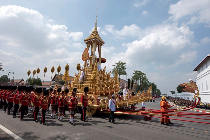 The symbolic urn of HM the late King Bhumibol Adulyadej is transported to the spectacular golden crematorium during the funeral procession in Bangkok, Thursday, Oct. 26. (AP Photo/Kittinun Rodsupan)
