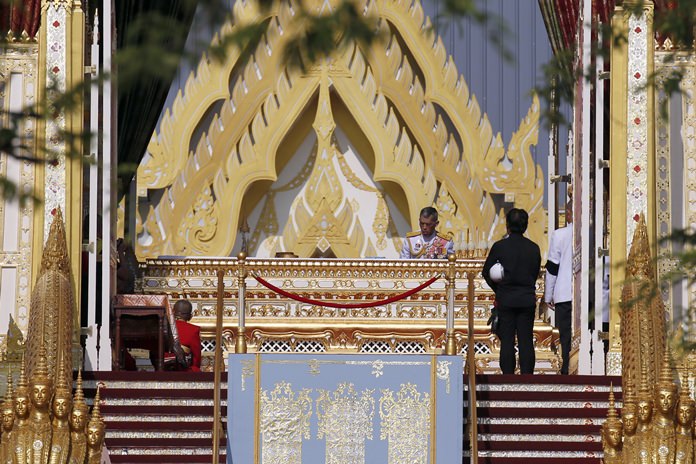 HM King Maha Vajiralongkorn (center) participates in religious rituals to move his father, late King Bhumibol Adulyadej’s ashes following the royal cremation ceremony. (AP Photo/ Sakchai Lalit)
