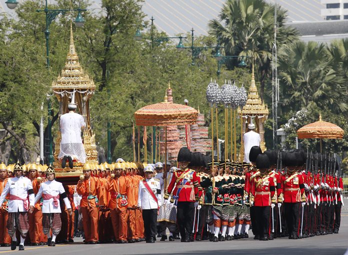Participants march in religious rituals to move the ashes of the late King Bhumibol Adulyadej, Friday, Oct. 27, 2017. (AP Photo/Sakchai Lalit)