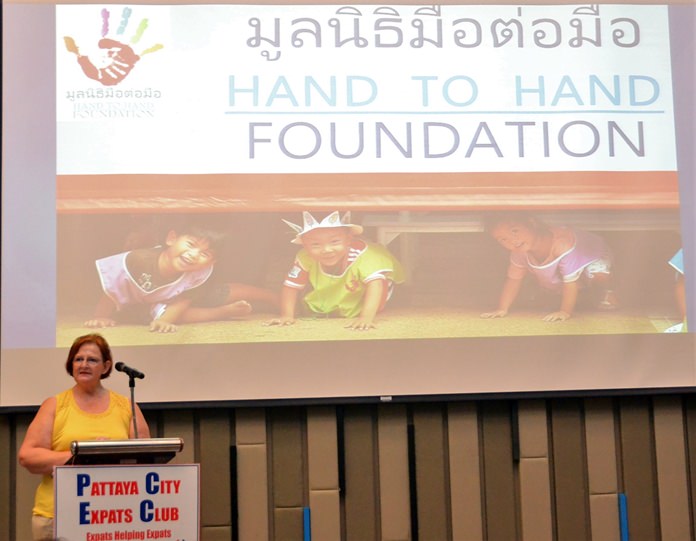 MC Ann Ensell introduces Margaret Grainger from Hand to Hand Foundation to the Pattaya City Expats Club.