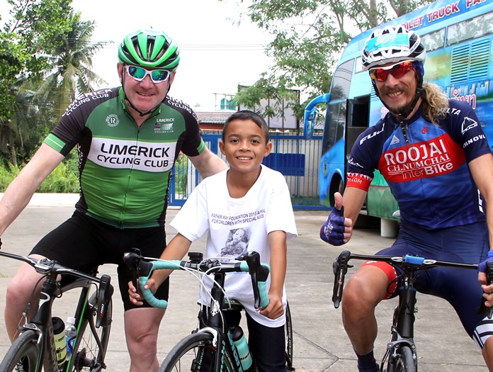 Expats Adrian and Alan pose with one of the boys from the Fr. Ray Foundation.