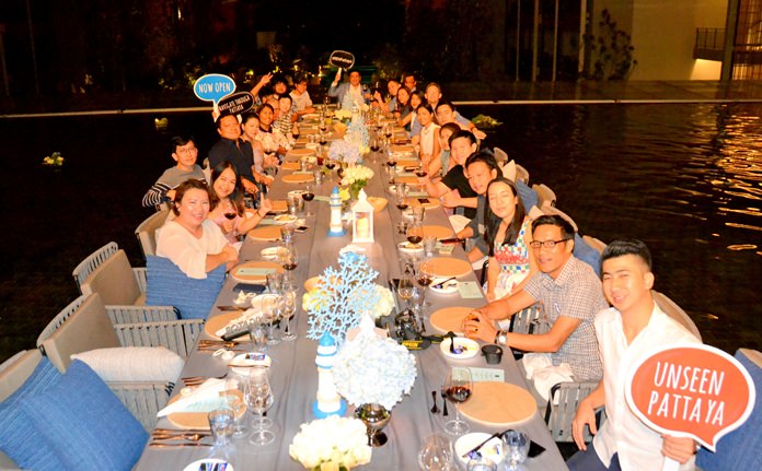 Guests wine & dine barefooted in the shallow pool.