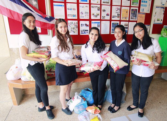 IB students from GIS helped collect dozens of bags of rice for Hand to Hand.