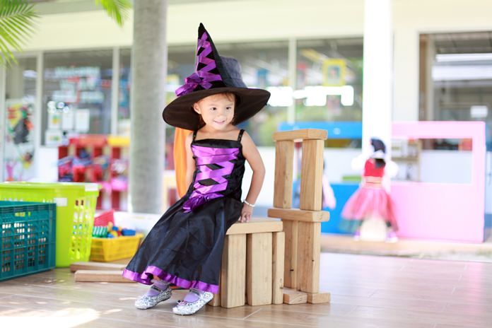 A wonderful-looking witch has fun at Halloween.