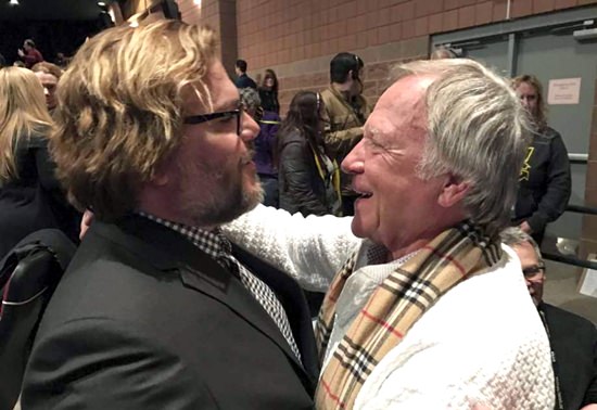 In a Jan. 22, 2017 photo, Jan Lewandowski (right), better known as Jan Lewan, embraces actor and comedian Jack Black at the premiere of “The Polka King” at the Sundance Film Festival in Park City, Utah. (John Koterba via AP)
