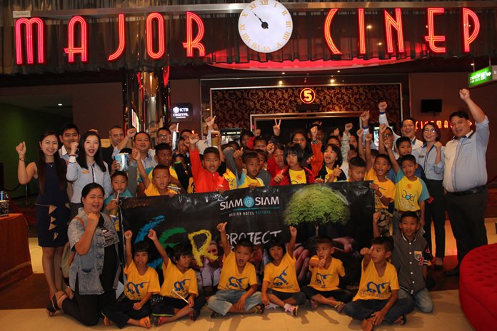 Kemikapak Thangjithikhun, assistant hotel training manager, and Phumpich Dabbarans bring over 40 children from Baan Jing Jai out to the movies.