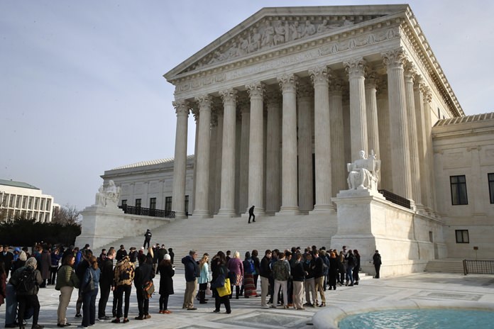 The Supreme Court is agreeing to decide the legality of the latest version of President Donald Trump’s ban on travel to the United States by residents of six mostly Muslim countries. (AP Photo/Jacquelyn Martin)