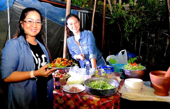 Pattaya Mail HR Manager Suthasinee Maneekul and Jurairat Kanchana whip up mouth-watering somtam dishes for the guests.