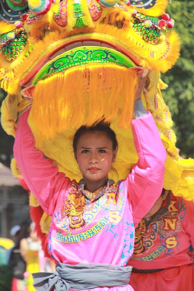 A young lady performs the lion dance.