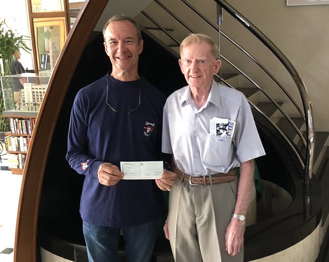 Michael presenting his donation to Lewis Underwood for this year’s Jester’s charity drive.