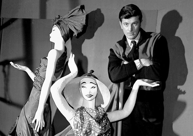 In this Feb.1 1952 file photo, French fashion designer Hubert de Givenchy poses with mannequins in his shop in Paris. (AP Photo)
