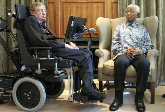 In this Thursday, May 15, 2008 file photo former South African President Nelson Mandela, right, meets with British scientist Professor Stephen Hawking, left, in Johannesburg. (AP Photo/Denis Farrell, File)