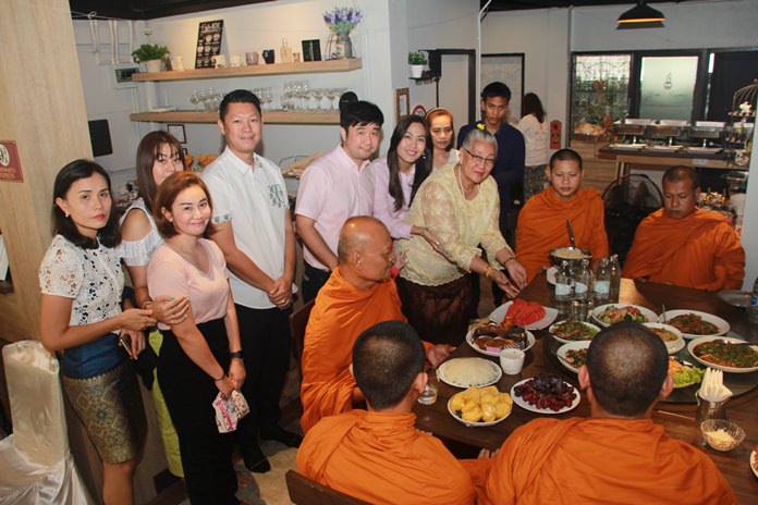 Owner Phisut Saekhu, family members and friends take part in a merit-making ceremony to get Yes Vegan off to a fortuitous start.