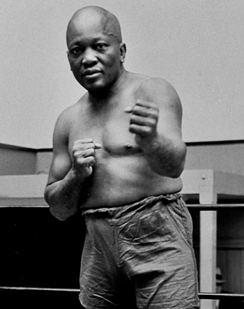 In this 1932 file photo, boxer Jack Johnson, the first black world heavyweight champion, poses in New York City. (AP Photo)