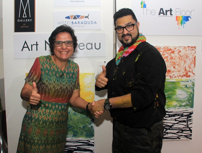 Founder of the Hand to Hand Foundation, Margaret Grainger thanks CEO and founder of The Art Floor, Dashmeet Singh, for the charitable donations.