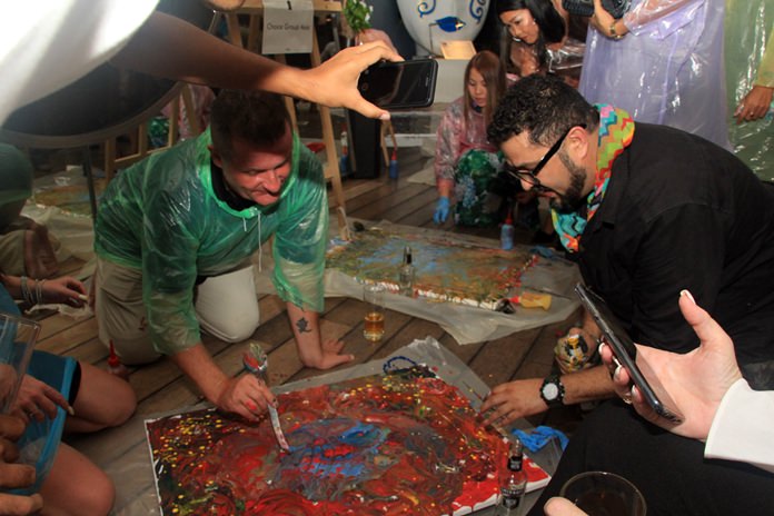 Guests enjoy their hands on experience with water colors.