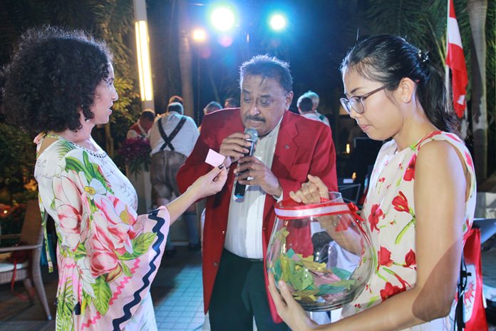 Anselma and Peter, assisted by Khun Nutsara conduct the drawing of raffle prizes.