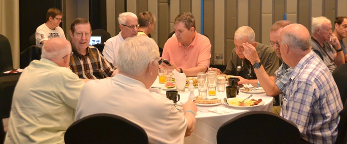 Members and guests enjoy their breakfast buffet and conversation before the start of the Sunday morning PCEC meeting at the Holiday Inn Executive Tower.