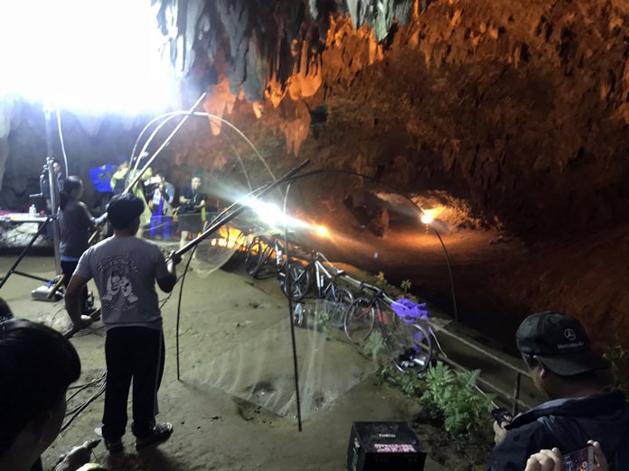 Relatives hold fishing nets, as a symbol to fish out lost spirits inside cave, as a group of locals and relatives perform a ritual calling for those are missing at the entrance of the cave, Tuesday, June 26, 2018, in Mae Sai, Chiang Rai province, northern Thailand. Electricians are extending a power line into a flooded cave in northern Thailand to help the search and rescue efforts for 12 boys and their soccer coach stranded three nights in the sprawling caverns and cut off by rising water. (AP Photo/Tassanee Vejpongsa)