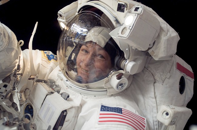 In this Jan. 30, 2008 photo made available by NASA, Expedition 16 commander Peggy Whitson, the first female commander of the International Space Station, participates in a spacewalk. On Friday, June 15, 2018, NASA announced Whitson, who has spent more time off the planet than any other American, has retired. (NASA via  AP)