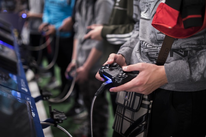 A man plays a game at the Paris Games Week in Paris. The World Health Organization says that compulsively playing video games now qualifies as a new mental health condition, in a move that some critics warn may risk stigmatizing its young players. (AP Photo/Kamil Zihnioglu, File)