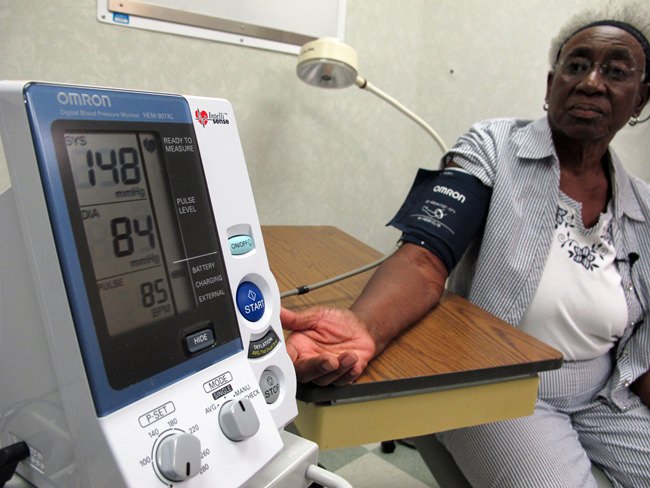 Margaret Graham, 74, has her blood pressure checked while visiting the Wake Forest Baptist Medical Center in Winston-Salem, N.C., on Friday, July 13, 2018. She had participated in a multi-year study, published on Wednesday, July 25, 2018, investigating a connection between high blood pressure and the risk of mental decline. (AP Photo/Allen G. Breed)