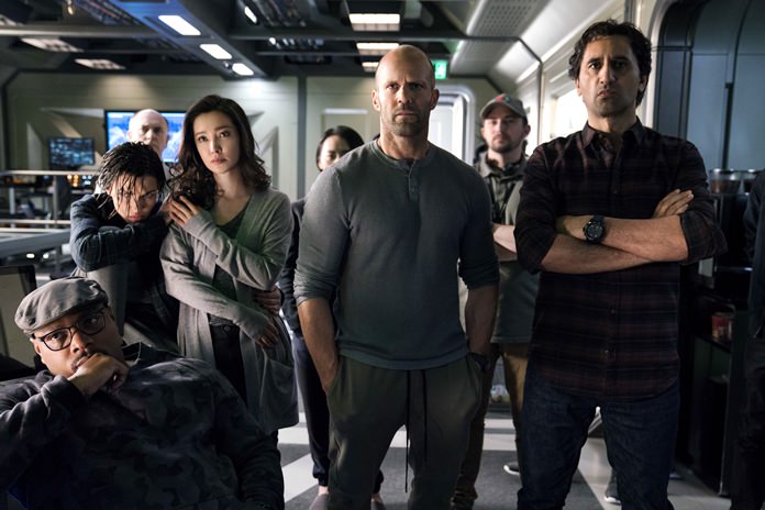 This image shows (foreground from left) Page Kennedy, Ruby Rose, Li Bingbing, Jason Statham and Cliff Curtis in a scene from the film, “The Meg.” (Warner Bros. Entertainment via AP)