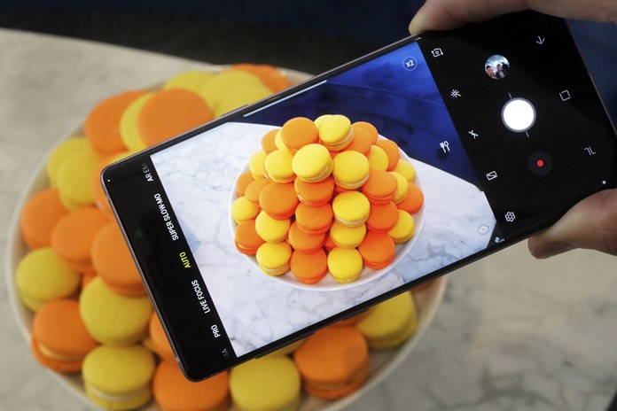 The Samsung Galaxy Note 9 is shown in New York. For $1,000, the Galaxy Note 9 is a superb phone that’s the best Samsung has to offer. But for a few hundred dollars less, the Galaxy S9 offers many of the features the Note 9 is now getting, including zippy speeds and camera improvements. (AP Photo/Richard Drew, File)