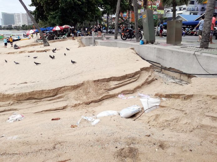 Heavy rain and flooding carved huge trenches out of the sand near the Pattaya Police Station.