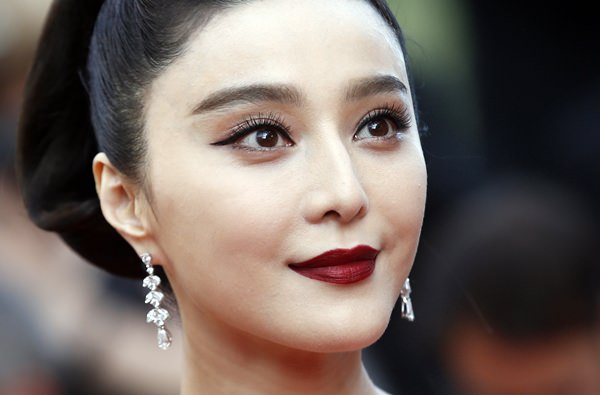 In this May 24, 2017, file photo, Fan Bingbing poses for photographers as she arrives for the screening of the film The Beguiled at the 70th international film festival, Cannes, southern France. (AP Photo/Alastair Grant, File)