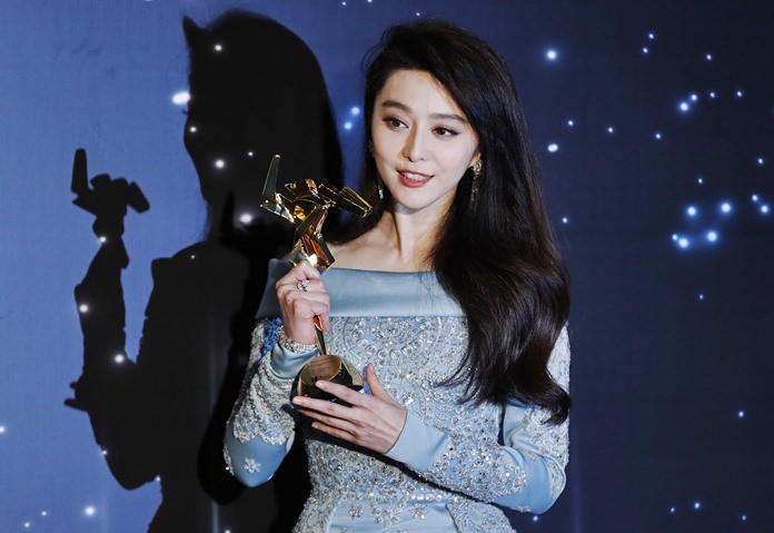 In this March 21, 2017, file photo, Chinese actress Fan Bingbing poses after winning the Best Actress Award of the Asian Film Awards in Hong Kong. (AP Photo/Kin Cheung, File)
