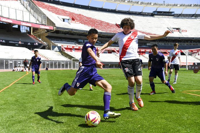 Young soccer Thai team Wild Boars play a friendly match against River Plate youth team at Monumental stadium in Buenos Aires, Argentina, Sunday, Oct. 7. (Eitan Abramovich/Pool via AP)