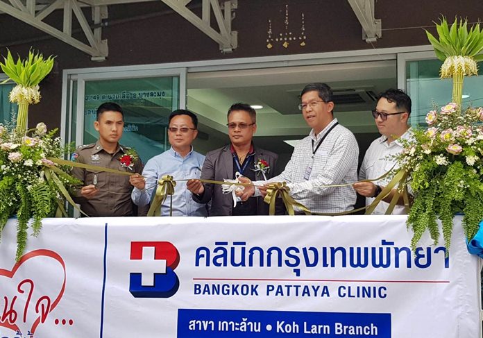 Executives cut the ceremonial ribbon to open Bangkok Hospital Pattaya’s new clinic on Koh Larn.