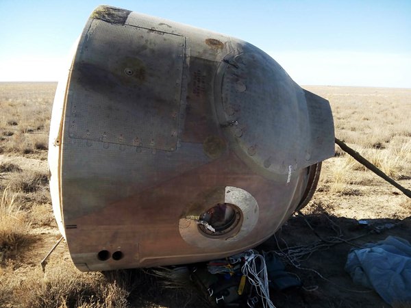 In this photo provided by Russian Defense Ministry Press Service, the Soyuz MS-10 space capsule lays in a field after an emergency landing near Dzhezkazgan, about 450 kilometers (280 miles) northeast of Baikonur, Kazakhstan, Thursday, Oct. 11, 2018. (Russian Defense Ministry Press Service photo via AP)