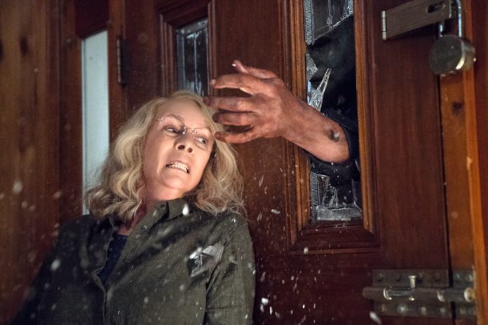 This image released by Universal Pictures shows Jamie Lee Curtis in a scene from "Halloween". (Ryan Green/Universal Pictures via AP)