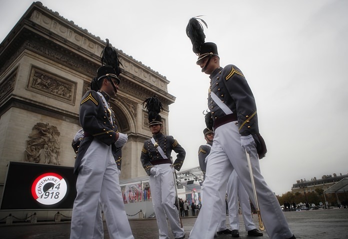 Cadets form the New York military academy wait near the Arc de Triomphe Sunday, Nov. 11, 2018 in Paris. (AP Photo/Francois Mori, Pool)