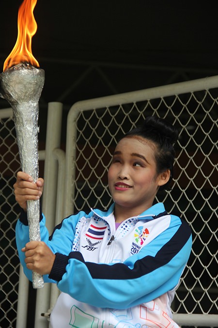 Carrying the flame to open the games.