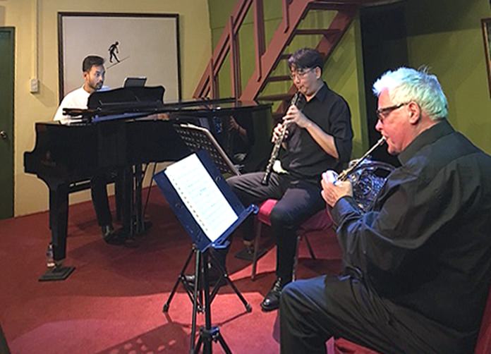 (From left) Hazim Suhadi (piano), Cooper Wright (oboe), and Bob Stoel (horn) of the Bandung Trio perform at Ben’s Theatre in Jomtien.