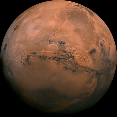 This image made available by NASA shows the planet Mars. This composite photo was created from over 100 images of Mars taken by Viking Orbiters in the 1970s. In our solar system family, Mars is Earth’s next-of-kin, the next-door relative that has captivated humans for millennia. (NASA via AP, File)