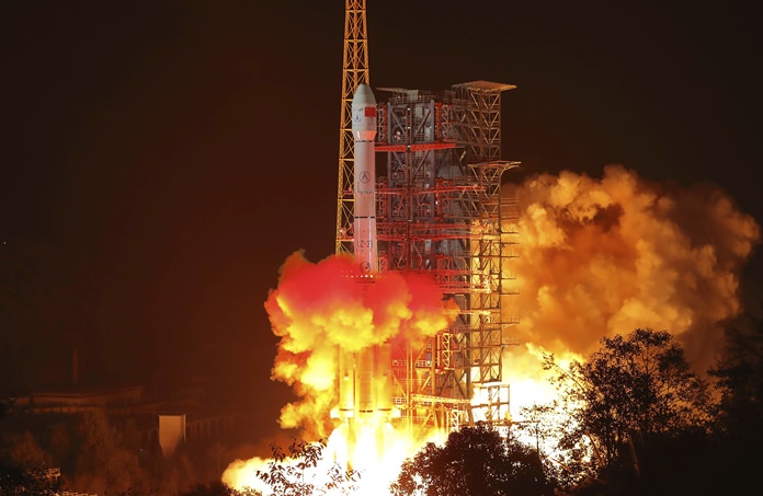 In this photo released by Xinhua News Agency, the Chang'e 4 lunar probe launches from the Xichang Satellite Launch Center in southwest China's Sichuan Province, Saturday, Dec. 8, 2018. (Jiang Hongjing/Xinhua via AP)