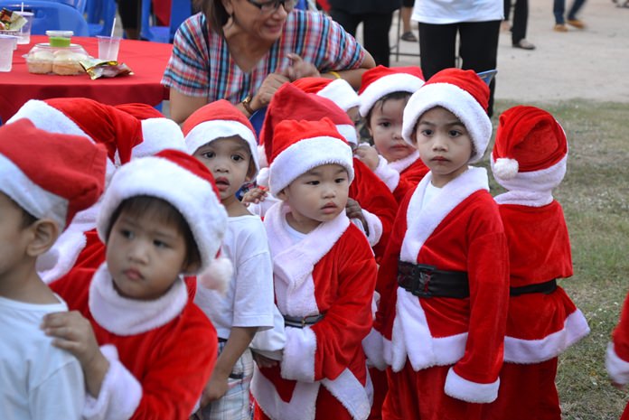Little Santa’s helpers line up to meet the big guy.