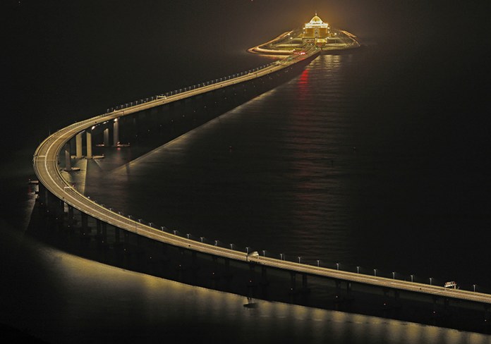 Hong Kong-Zhuhai-Macau Bridge, a total length of 55 kilometers (34 miles), is lit up in Hong Kong on Oct. 21, 2018. (AP Photo/Vincent Yu)