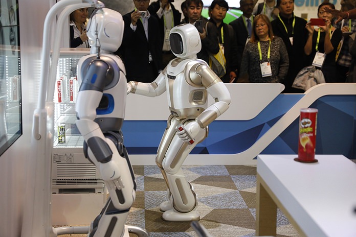 The Walker robot grabs a soda can during a demonstration at the Ubtech booth at CES International, Wednesday, Jan. 9, 2019, in Las Vegas. (AP Photo/John Locher)