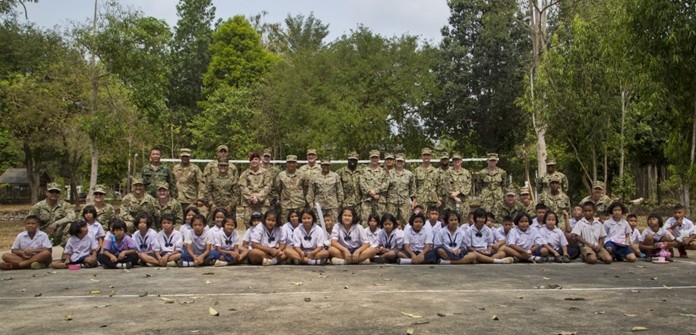 U.S. and Royal Thai service members and students from the Ban Man Kroi School come together for a group photo during exercise Cobra Gold 19 at Ban Man Kroi School, Rayong, Feb. 5, 2019. (U.S. Marine Corps photo by Lance Cpl. Kenny Nunez.)