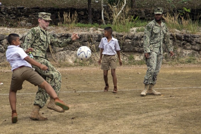 U.S. Navy service members and students from the Ban Man Kroi School play soccer together during exercise Cobra Gold 19 at Ban Man Kroi School, Rayong, Feb. 5, 2019. (U.S. Marine Corps photo by Lance Cpl. Kenny Nunez.)
