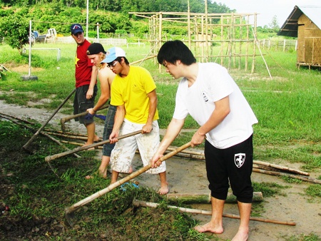 IB students work the land in weather that switched from baking heat to heavy rain almost daily.